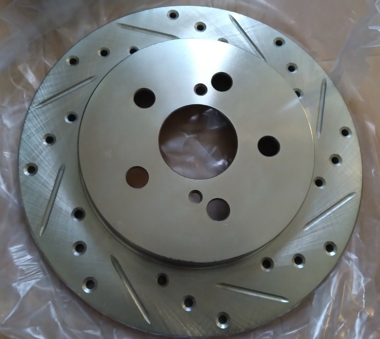 Dynamic Friction 631-76083R – Drilled and Slotted Silver Zinc Brake Rotor